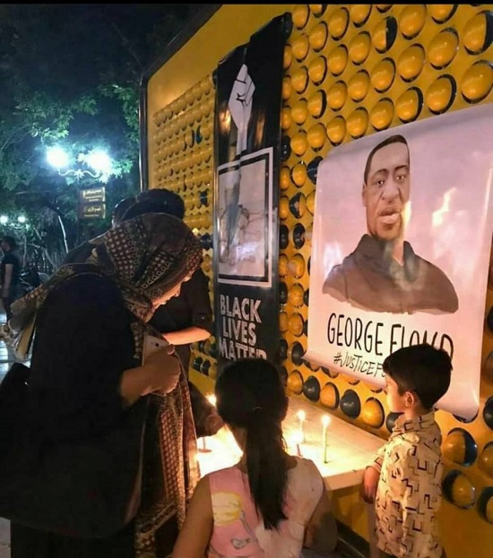 روشن‌کردن شمع به یاد جورج فلوید در مشهد